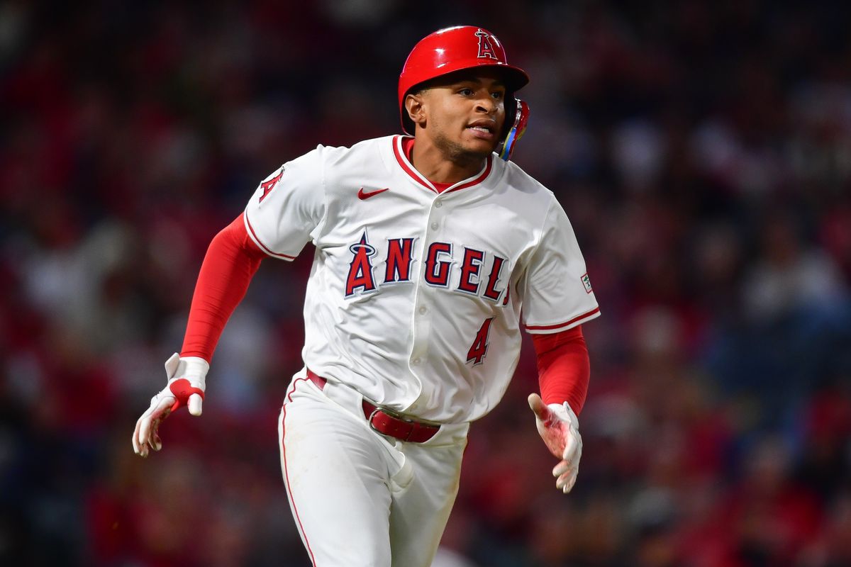 Los Angeles Angels second baseman Christian Moore (4) runs after hitting a double against the Houston Astros during the fifth inning at Angel Stadium.