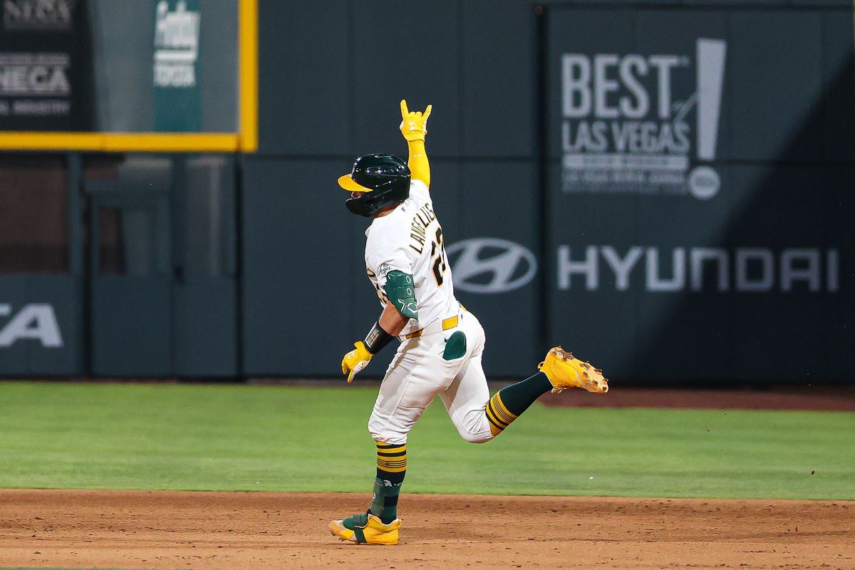 Athletics C Shea Langeliers (23) signals to the bullpen after hitting a home run against the Colorado Rockies on Friday June 12, 2026, at the Las Vegas Ballpark in Las Vegas, Nevada.