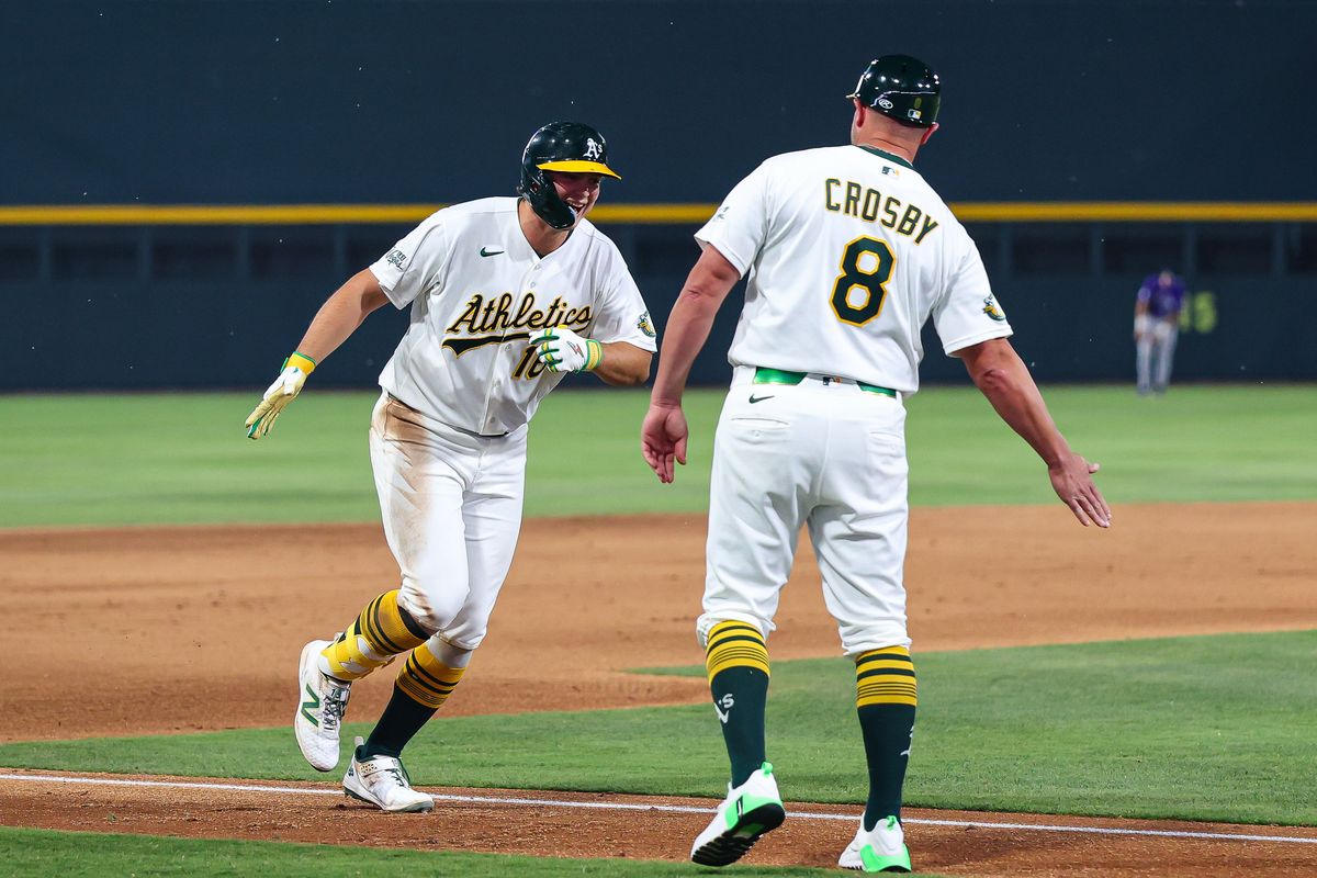 Athletics 1B Nick Kurtz (16) goes to high five third base coach Bobby Crosby (8) after hitting a home run against the Colorado Rockies on Friday June 12, 2026, at the Las Vegas Ballpark in Las Vegas, Nevada.