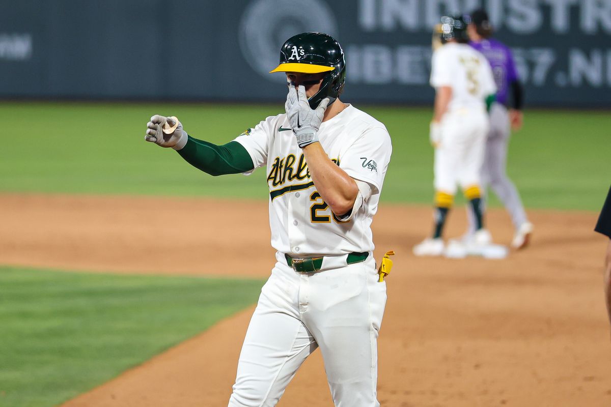 Athletics 2B Zack Gelof (20) points towards the dugout after hitting a single against the Colorado Rockies on Friday June 12, 2026, at the Las Vegas Ballpark in Las Vegas, Nevada.