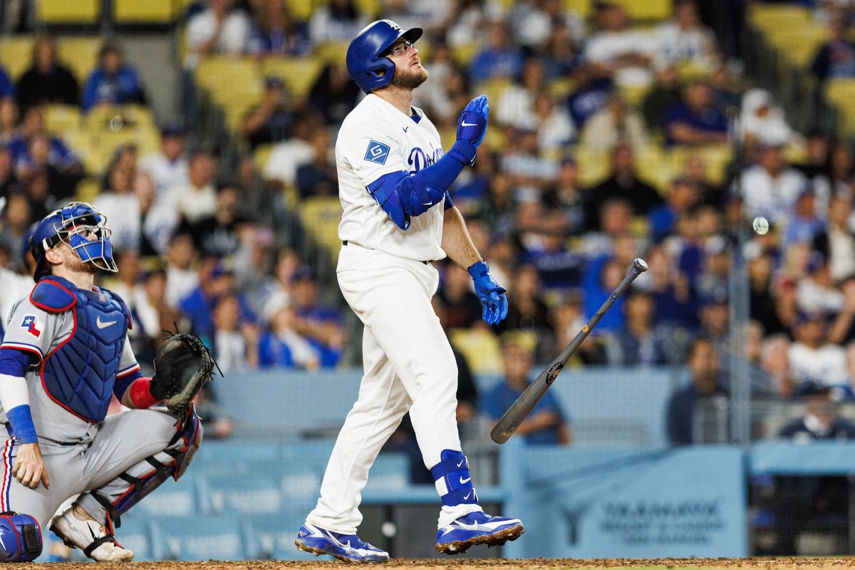 Max Muncy #13 of the Los Angeles Dodgers hits a walk-off home run during an MLB game against the Texas Rangers at Dodger Stadium on April 10, 2026 in Los Angeles, California.