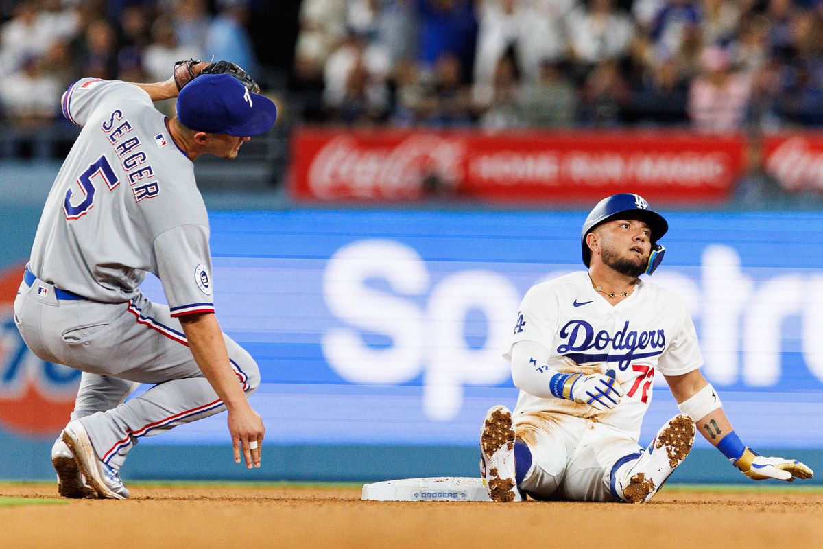 Miguel Rojas #72 of the Los Angeles Dodgers reacts after getting caught stealing second base during an MLB game against the Texas Rangers at Dodger Stadium on April 10, 2026 in Los Angeles, California.
