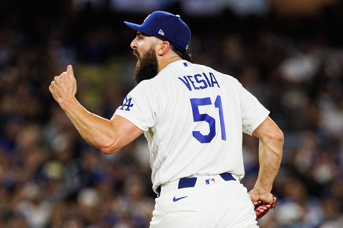 Alex Vesia #51 of the Los Angeles Dodgers celebrates after an inning-ending strikeout during an MLB game against the Texas Rangers at Dodger Stadium on April 10, 2026 in Los Angeles, California.