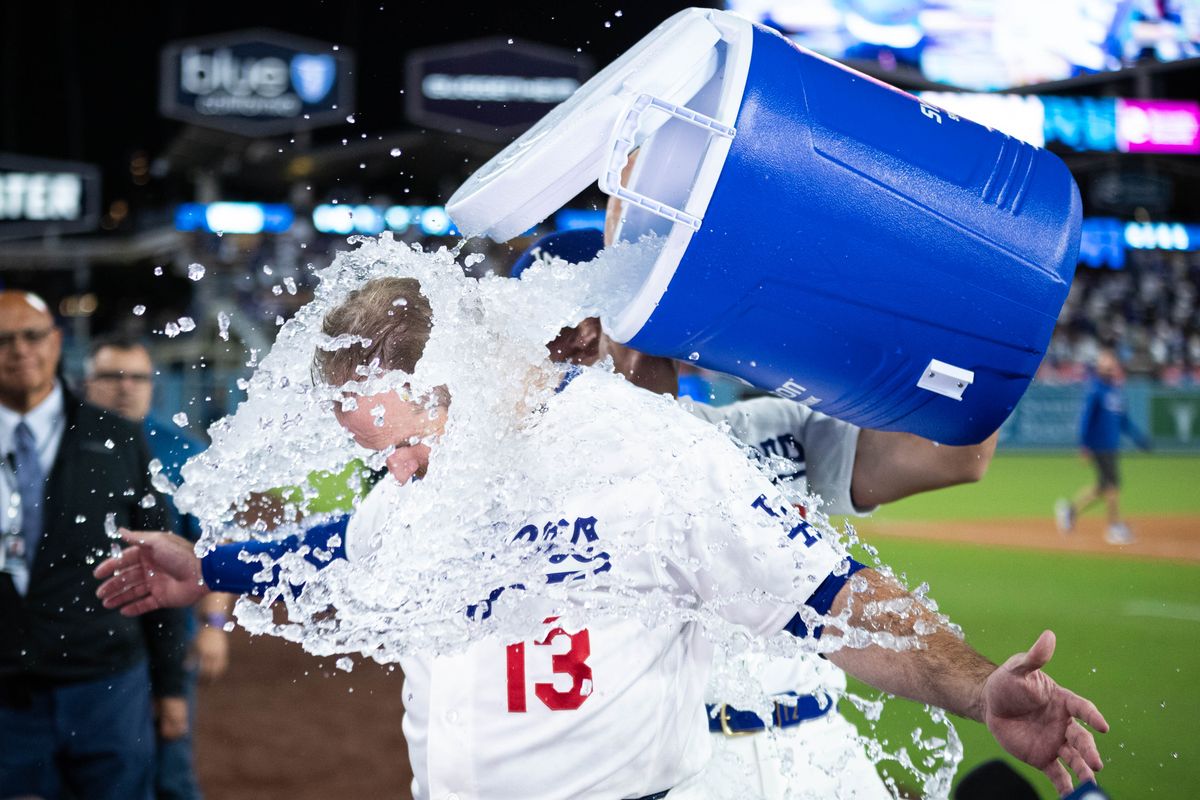 Max Muncy #13 of the Los Angeles Dodgers celebrates after an MLB game against the Texas Rangers at Dodger Stadium on April 10, 2026 in Los Angeles, California.