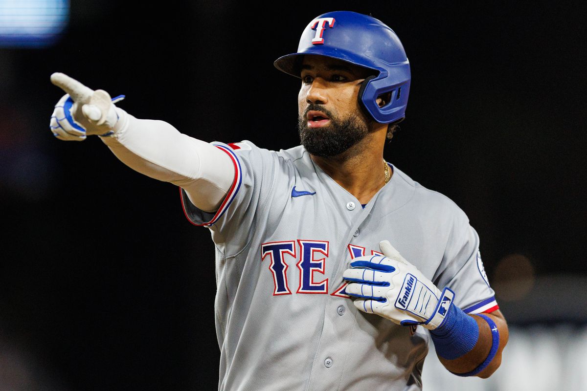 Ezequiel Durán #20 of the Texas Rangers celebrates after hitting a single during an MLB game against the Los Angeles Dodgers at Dodger Stadium on April 10, 2026 in Los Angeles, California.
