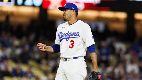 Edwin Díaz #3 of the Los Angeles Dodgers signals a strike during an MLB game against the Texas Rangers at Dodger Stadium on April 10, 2026 in Los Angeles, California.