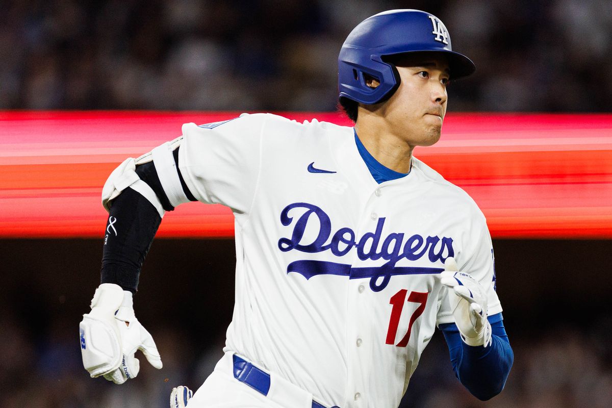 Shohei Ohtani #17 of the Los Angeles Dodgers runs to first base during an MLB game against the Texas Rangers at Dodger Stadium on April 10, 2026 in Los Angeles, California.