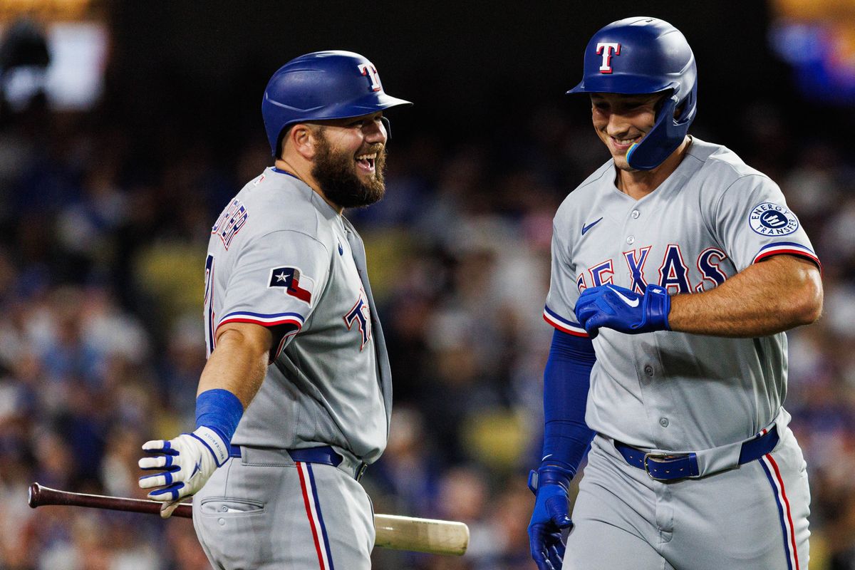 Wyatt Langford #36 of the Texas Rangers celebrates after scoring a run during an MLB game against the Los Angeles Dodgers at Dodger Stadium on April 10, 2026 in Los Angeles, California.