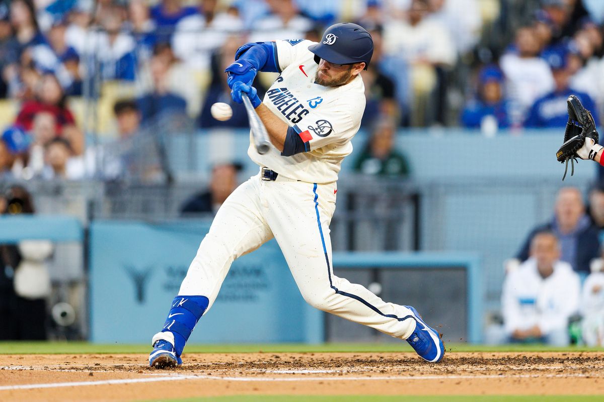 Max Muncy #13 of the Los Angeles Dodgers hits during the game against the Texas Rangers at Dodger Stadium on April 11, 2026 in Los Angeles, California. Max Muncy #13 of the Los Angeles Dodgers hits during the game against the Texas Rangers at Dodger Stadium on April 11, 2026 in Los Angeles, California.
