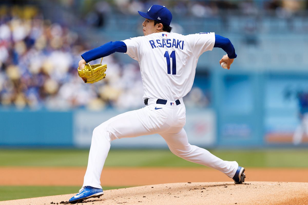 Roki Sasaki #11 of the Los Angeles Dodgers pitches during the game against the Texas Rangers at Dodger Stadium on April 12, 2026 in Los Angeles, California. 