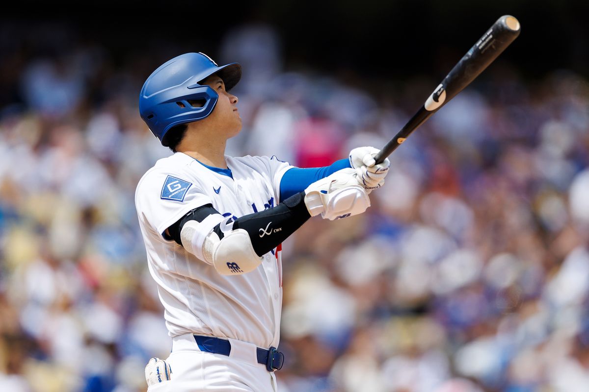 Shohei Ohtani #17 of the Los Angeles Dodgers reacts to his home run during the game against the Texas Rangers at Dodger Stadium on April 12, 2026 in Los Angeles, California. 