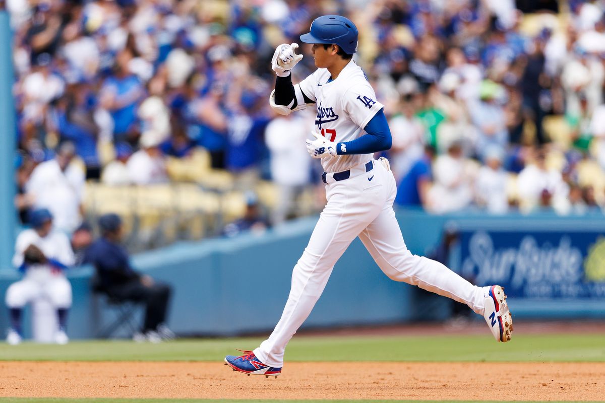 Shohei Ohtani #17 of the Los Angeles Dodgers celebrates his home run during the game against the Texas Rangers at Dodger Stadium on April 12, 2026 in Los Angeles, California. 