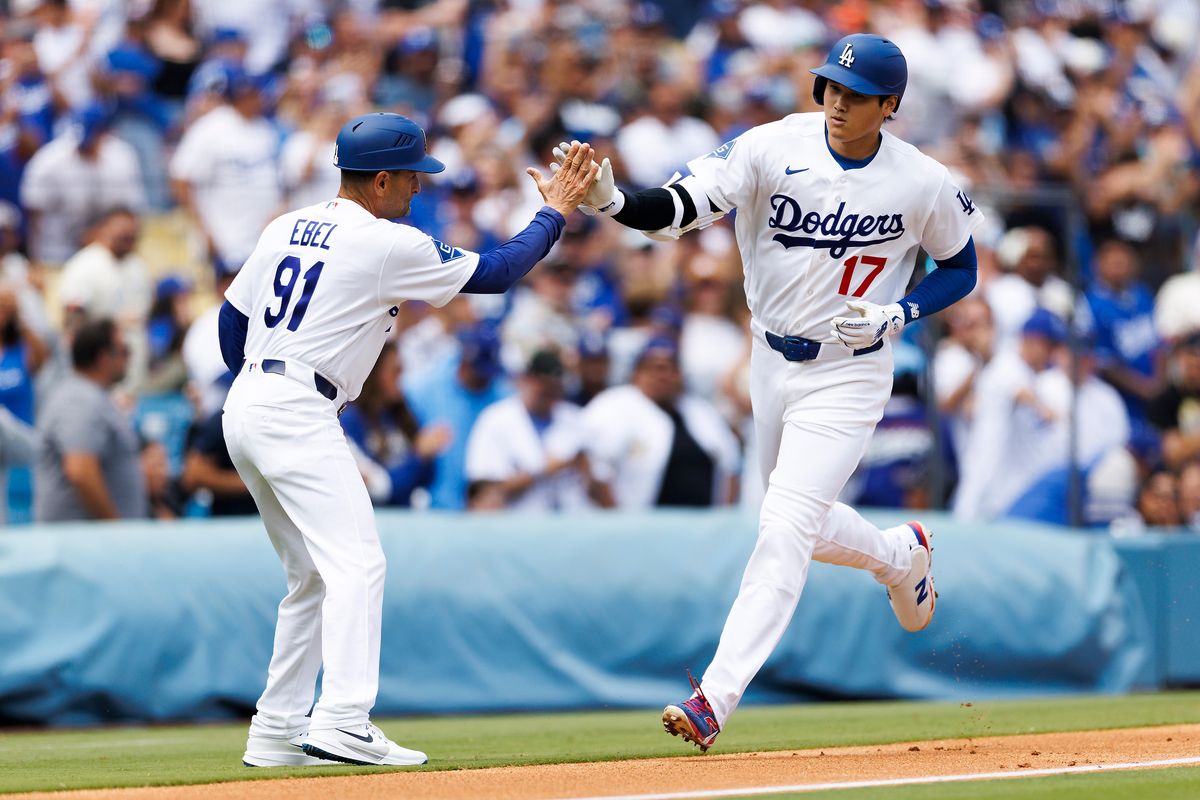 Shohei Ohtani #17 of the Los Angeles Dodgers celebrates his home run during the game against the Texas Rangers at Dodger Stadium on April 12, 2026 in Los Angeles, California. 