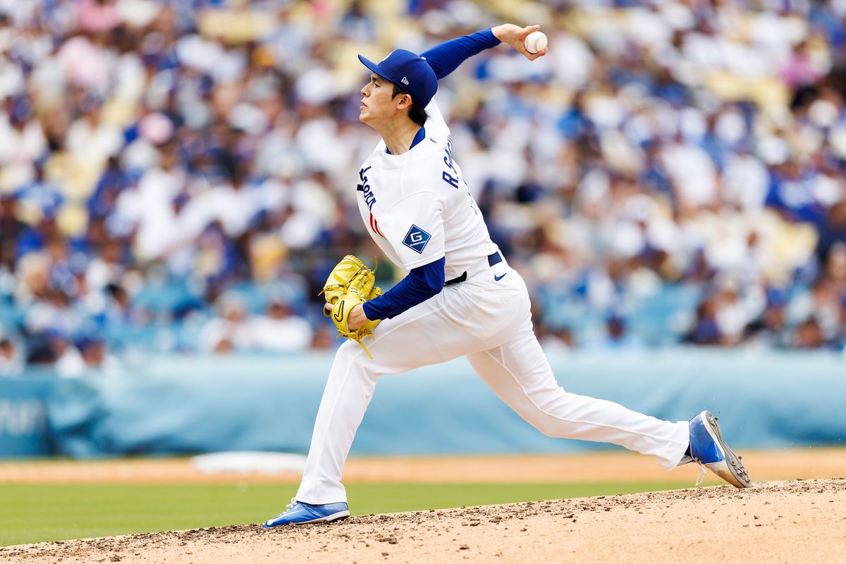 Roki Sasaki #11 of the Los Angeles Dodgers pitches during the game against the Texas Rangers at Dodger Stadium on April 12, 2026 in Los Angeles, California. 