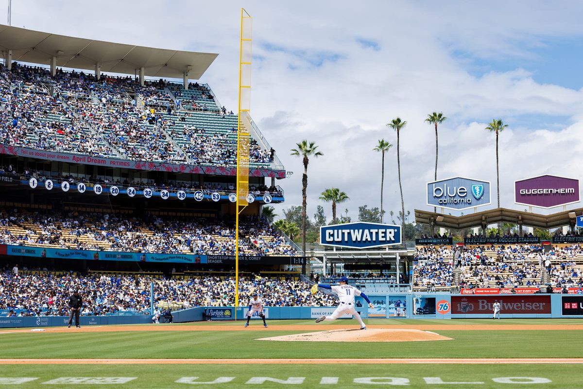 Roki Sasaki #11 of the Los Angeles Dodgers pitches during the game against the Texas Rangers at Dodger Stadium on April 12, 2026 in Los Angeles, California.