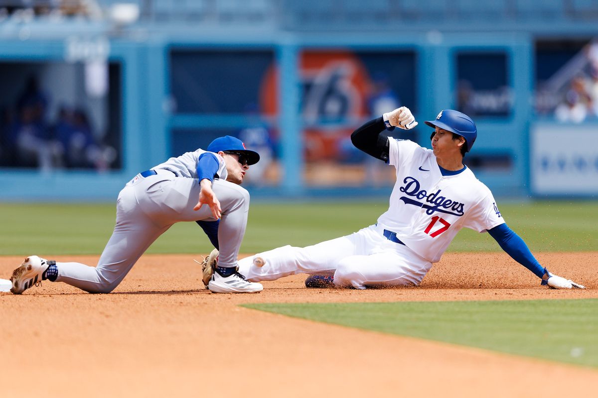 Shohei Ohtani #17 of the Los Angeles Dodgers slides into second base during the game against the Chicago Cubs at Dodger Stadium on April 26, 2026 in Los Angeles, California. 