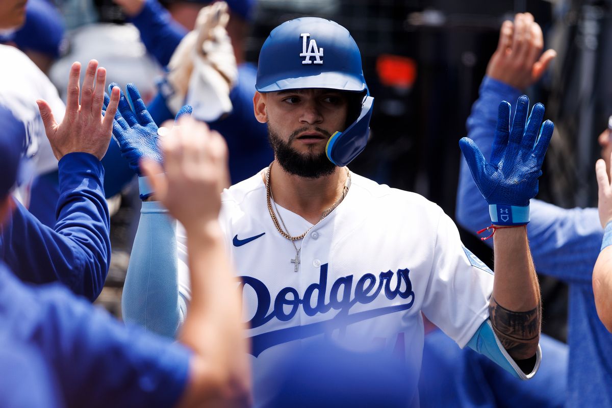 Andy Pages #44 of the Los Angeles Dodgers celebrates in the dugout during the game against the Chicago Cubs at Dodger Stadium on April 26, 2026 in Los Angeles, California. 