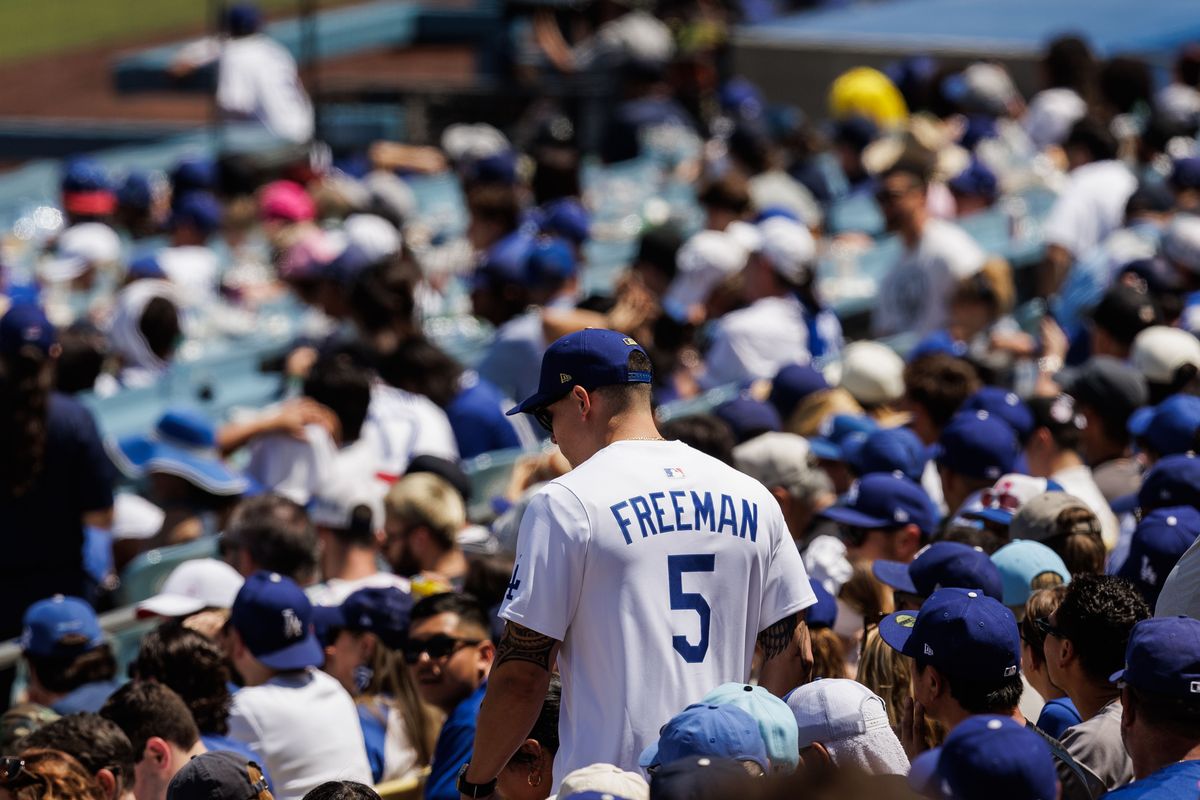 Los Angeles Dodgers fan wear Los Angeles Dodgers first baseman Freddie Freeman (5) jersey surrounded by other Los Angeles Dodger fans during an MLB game against the Atlanta Braves on May 10, 2026 in Los Angeles, CA.