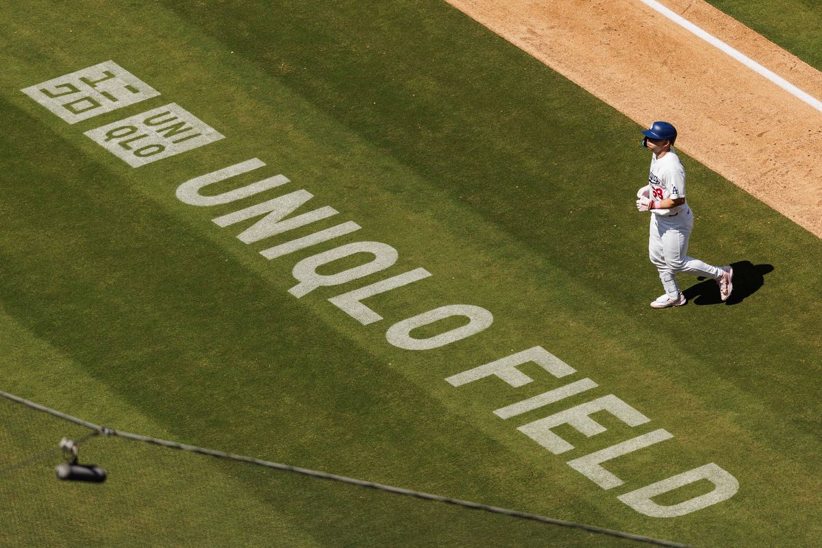 Los Angeles Dodgers catcher Dalton Rushing (68) runs back to dugout walking over “UNIQLO FIELD” during an MLB game against the Atlanta Braves on May 10, 2026 in Los Angeles, CA.
