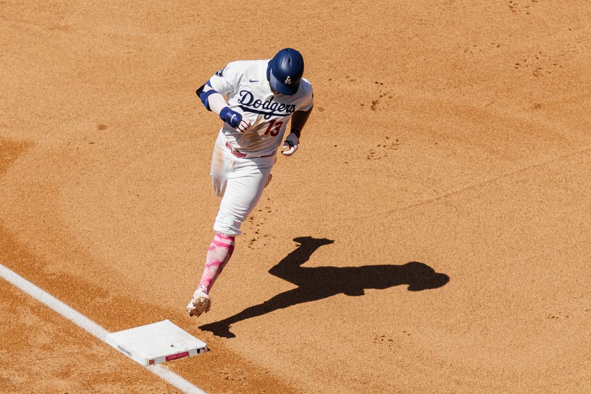 Los Angeles Dodgers third baseman Max Muncy (13) hits a home-run and runs back to home plate during an MLB game against the Atlanta Braves on May 10, 2026 in Los Angeles, CA.