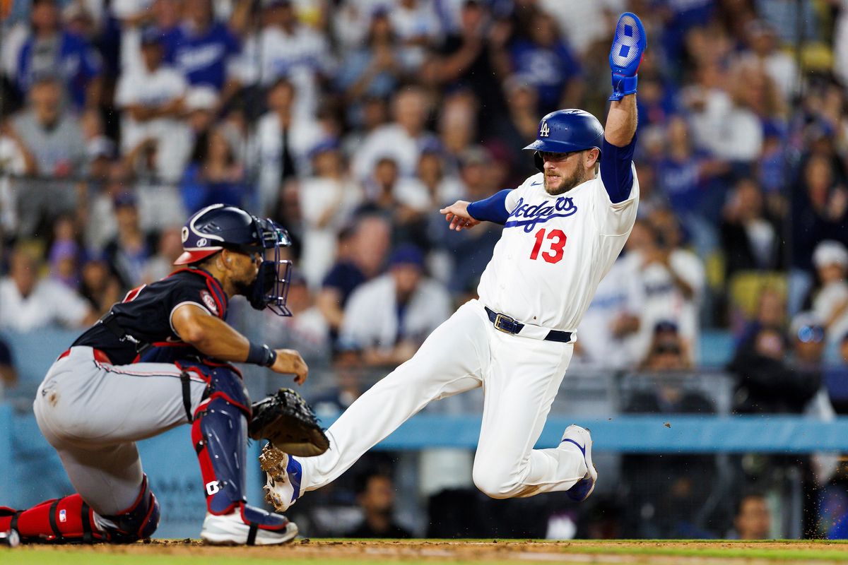 Max Muncy #13 of the Los Angeles Dodgers slides into home plate for a score during the game against the Washington Nationals at Dodger Stadium on September 6, 2026 in Los Angeles, California. Max Muncy #13 of the Los Angeles Dodgers slides into home plate for a score during the game against the Washington Nationals at Dodger Stadium on September 6, 2026 in Los Angeles, California.