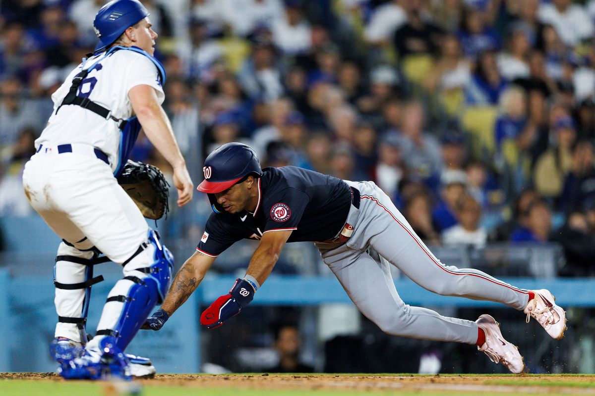 Daylen Lile #4 of the Washington Nationals slides into home plate during the game against the Los Angeles Dodgers at Dodger Stadium on September 6, 2026 in Los Angeles, California. Daylen Lile #4 of the Washington Nationals slides into home plate during the game against the Los Angeles Dodgers at Dodger Stadium on September 6, 2026 in Los Angeles, California.