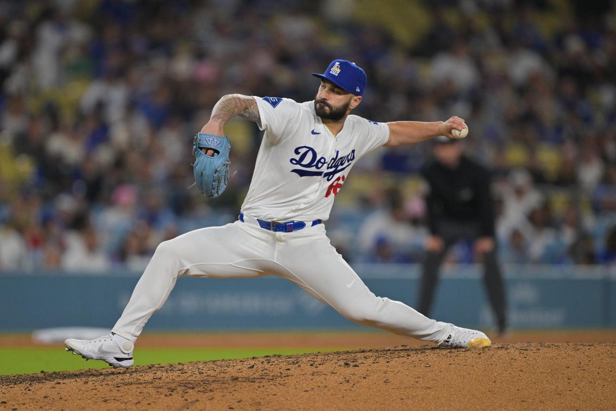 Los Angeles Dodgers pitcher Tanner Scott (66) pitches during the ninth inning against the Los Angeles Angels at Dodger Stadium. 