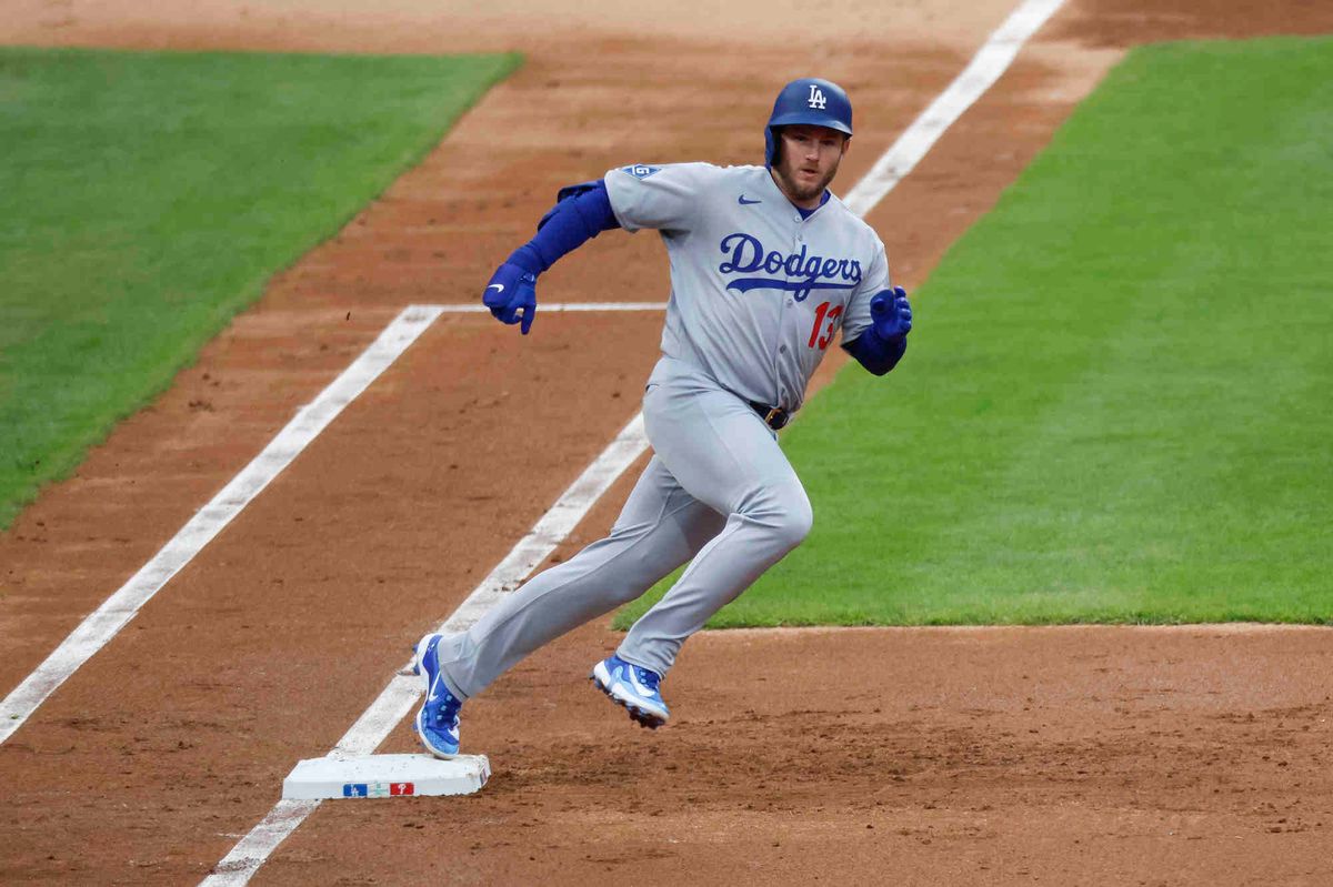 Max Muncy #13 of the Los Angeles Dodgers hits a double in the second inning during a game against the Philadelphia Phillies at Citizens Bank Park on April 5, 2025 in Philadelphia, Pennsylvania.