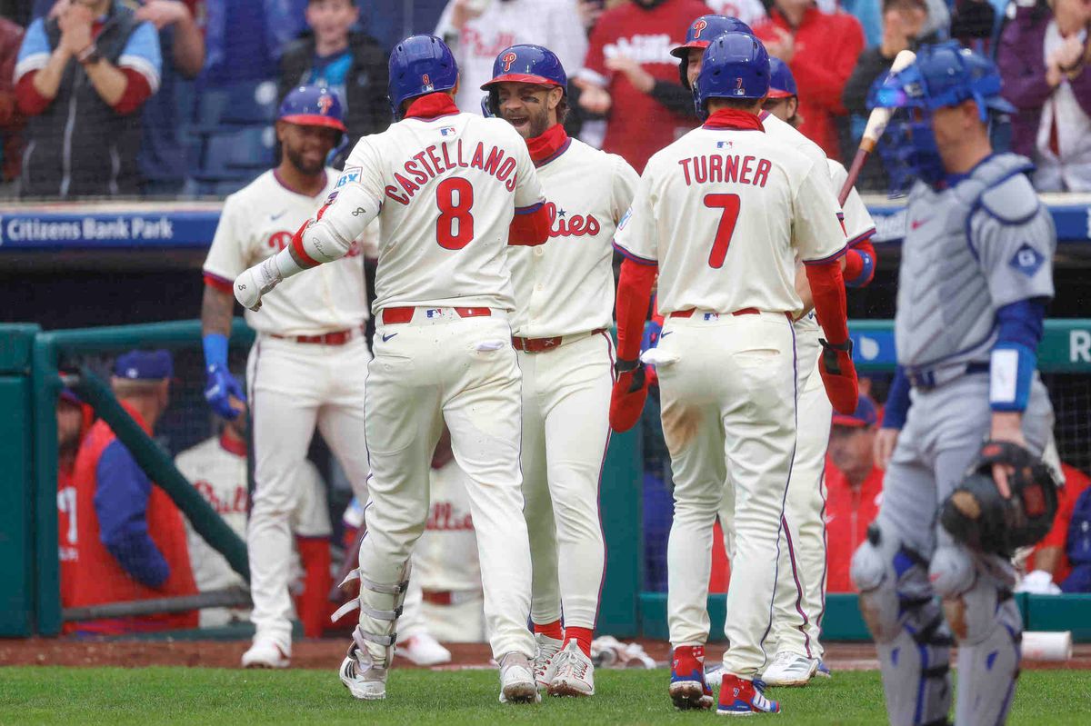 Nick Castellanos #8 of the Philadelphia Phillies celebrates a grand slam in the bottom of the third inning during a game against the Los Angeles Dodgers at Citizens Bank Park on April 4, 2025 in Philadelphia, Pennsylvania.