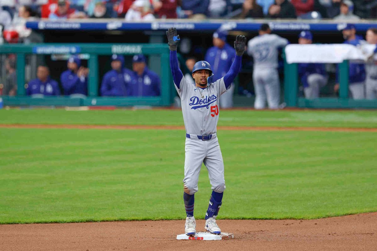 Mookie Betts #50 of the Los Angeles Dodgers celebrates an RBI double in the seventh inning during a game against the Philadelphia Phillies at Citizens Bank Park on April 4, 2025 in Philadelphia, Pennsylvania.