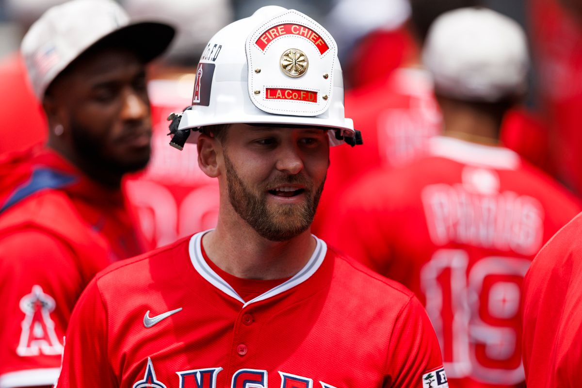 Taylor Ward #3 of the Los Angeles Angels celebrates his home run in the dugout during the game against the Los Angeles Dodgers at Dodger Stadium on May 18, 2025 in Los Angeles, California.