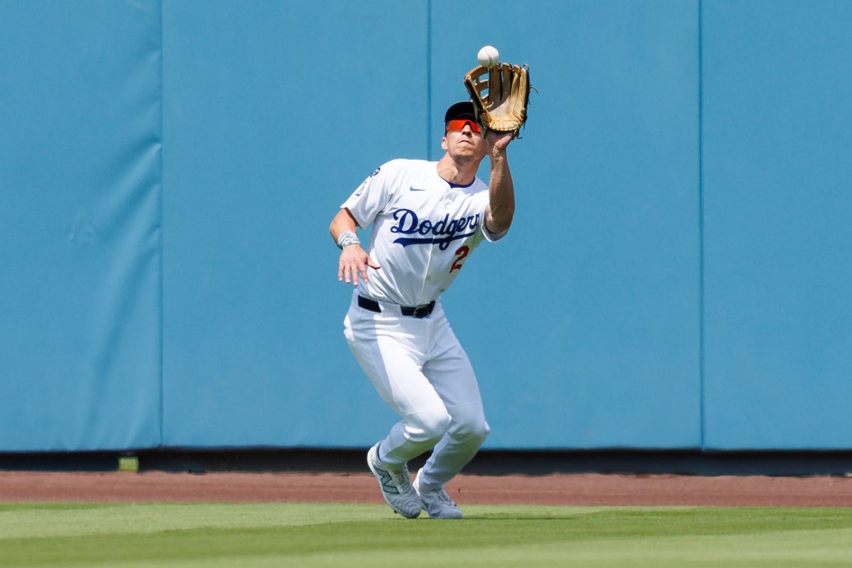 Michael Conforto #23 of the Los Angeles Dodgers catches a fly ball during the game against the Los Angeles Angels at Dodger Stadium on May 18, 2025 in Los Angeles, California. 