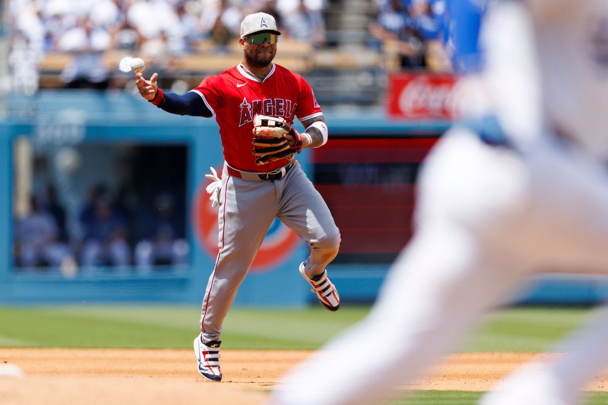 Yoán Moncada #5 of the Los Angeles Angels throws to first base during the game against the Los Angeles Dodgers at Dodger Stadium on May 18, 2025 in Los Angeles, California.