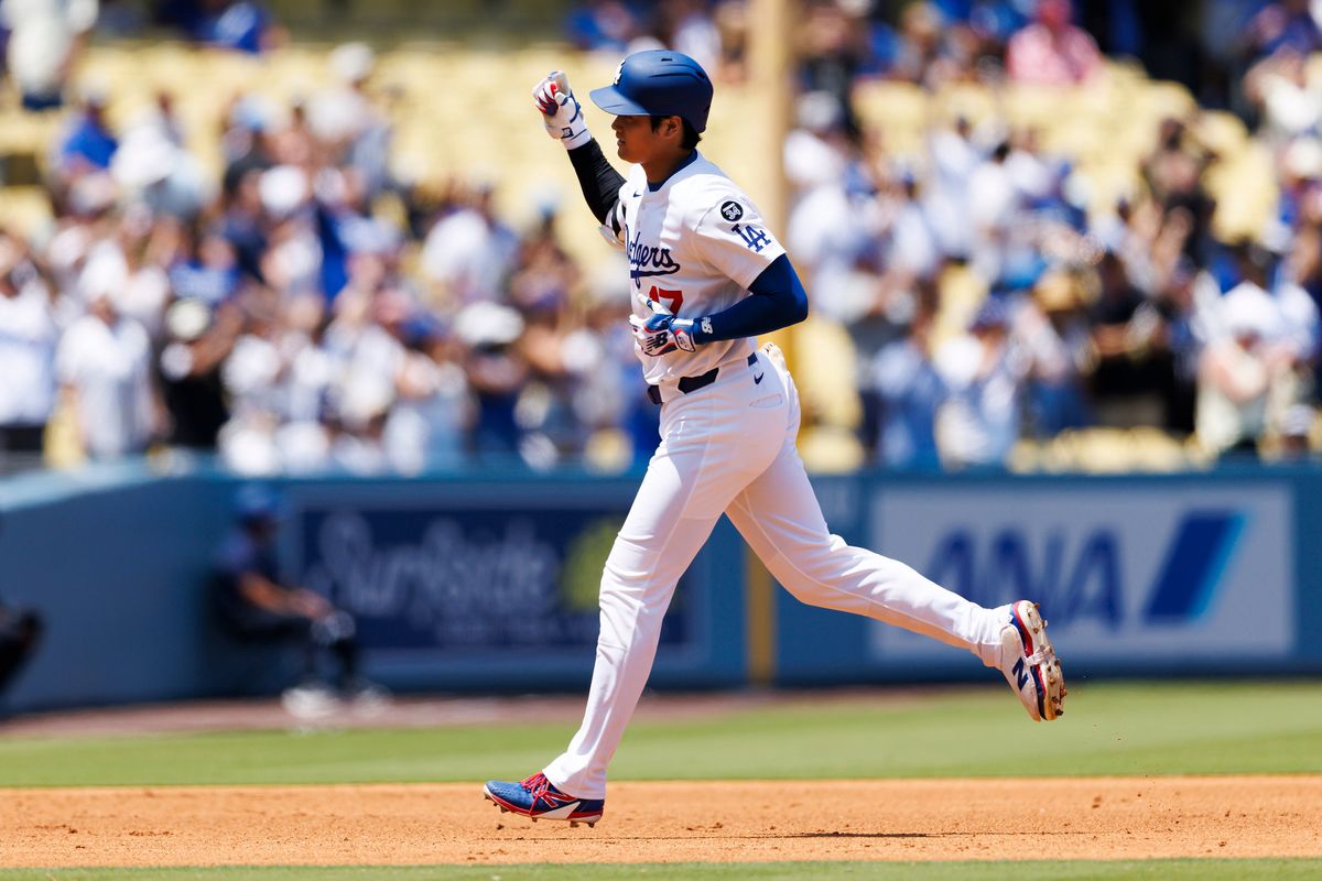 Shohei Ohtani #17 of the Los Angeles Dodgers celebrates his home run during the game against the Milwaukee Brewers at Dodger Stadium on July 20, 2025 in Los Angeles, California. 