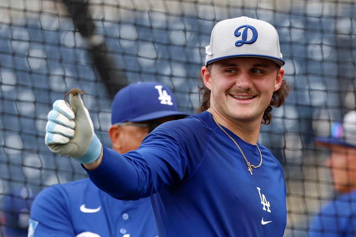 Alex Freeland #76 of the Los Angeles Dodgers gestures prior to a game against the Tampa Bay Rays at George M. Steinbrenner Field on August 01, 2025 in Tampa, Florida.