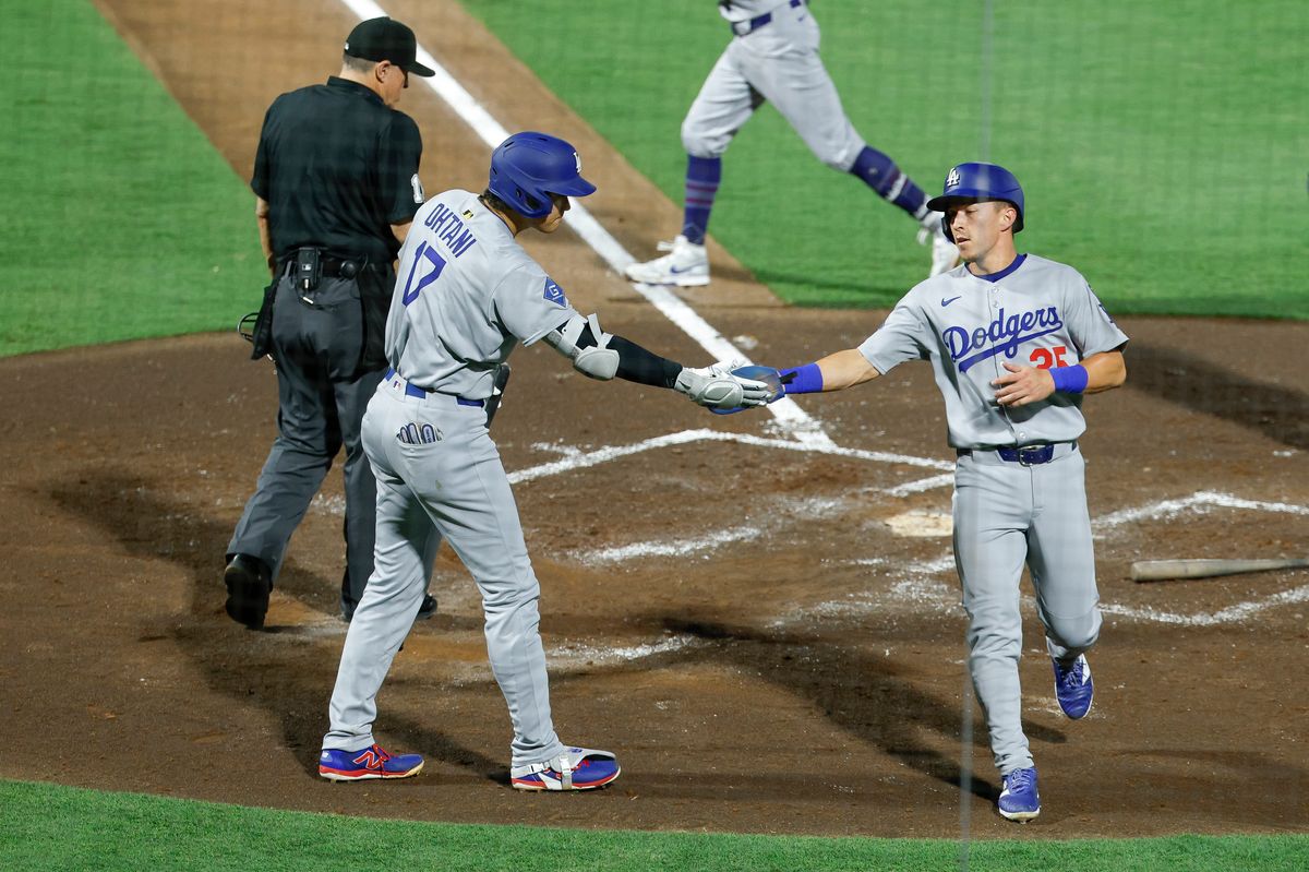 Tommy Edman #25 of the Los Angeles Dodgers scores a run against the Tampa Bay Rays at George M. Steinbrenner Field on August 01, 2025 in Tampa, Florida.
