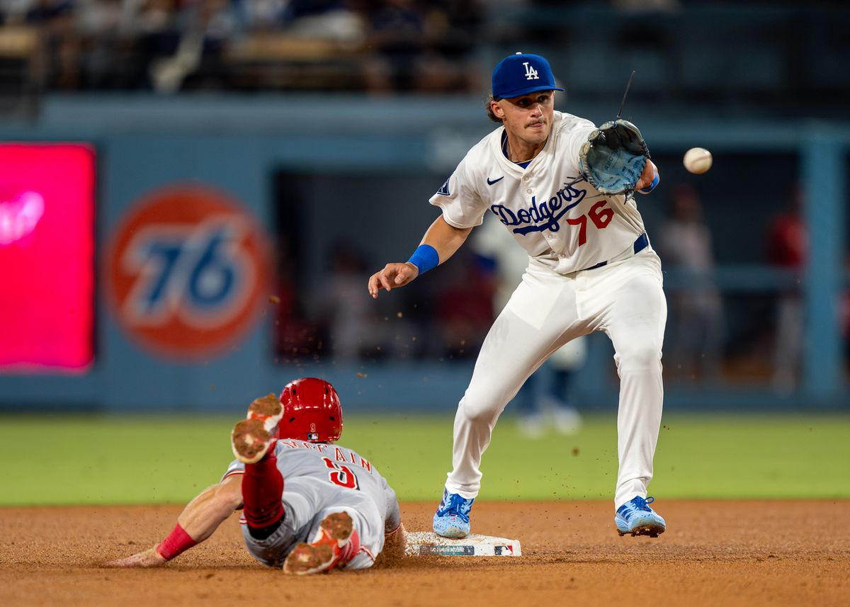 Los Angeles Dodgers infielder, Alex Freeland 76, saves second base with an out during an MLB baseball game against the Cincinnati Reds on August 26, 2025 in Los Angeles, CA.