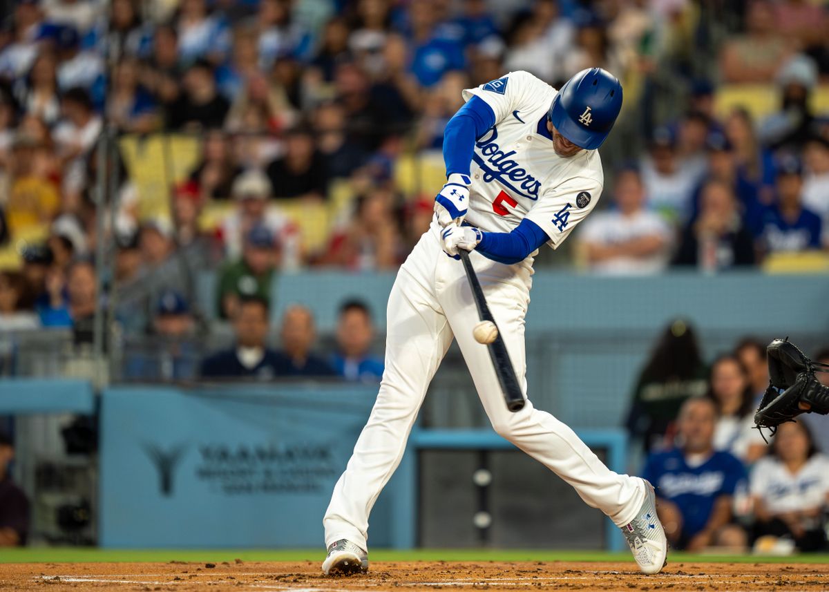 Los Angeles Dodgers infielder, Freddie Freeman 5, hits a line drive during an MLB baseball game against the Cincinnati Reds on August 26, 2025 in Los Angeles, CA.