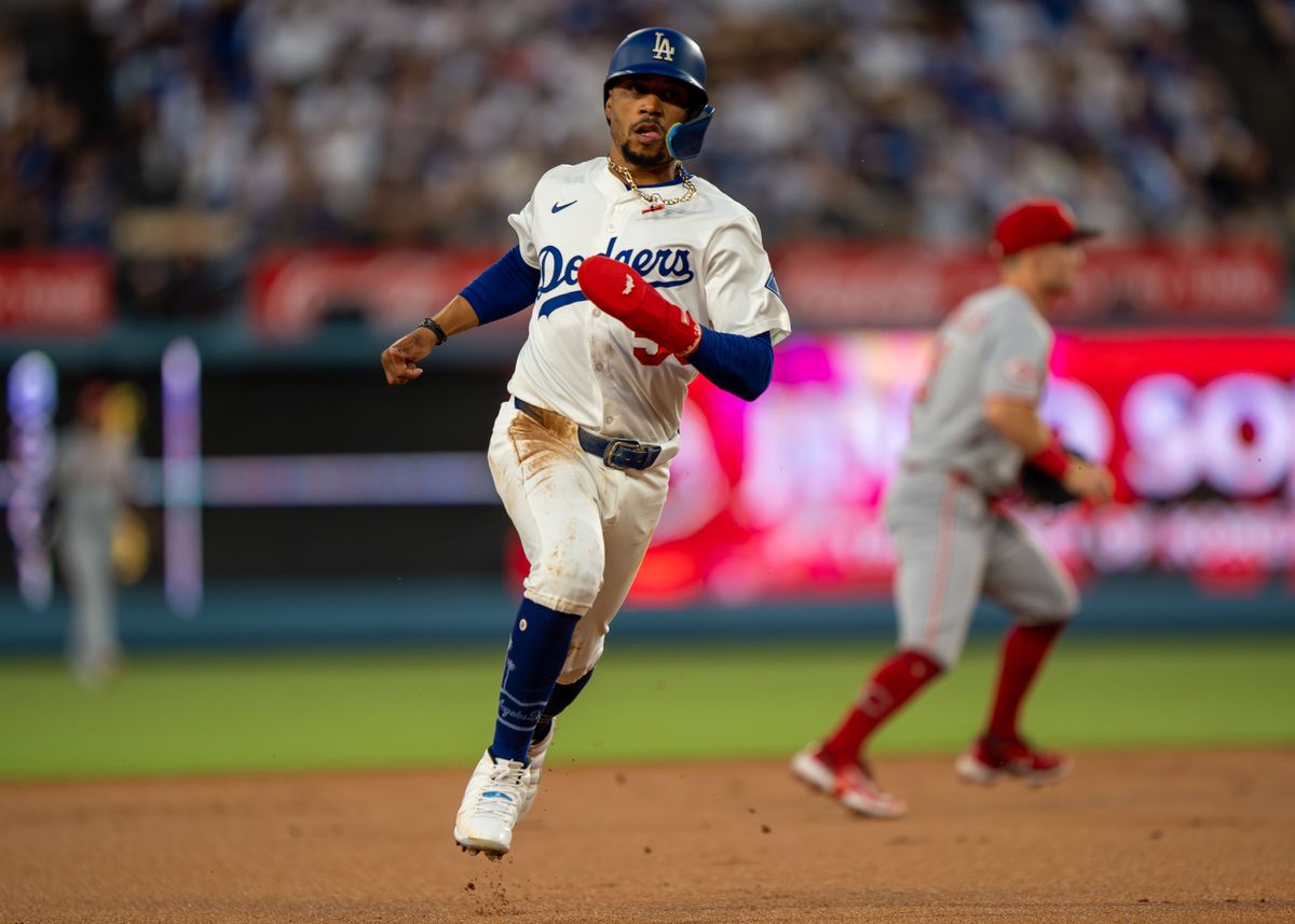 Los Angeles Dodgers infielder, Mookie Betts 50, sprints to 3rd base during an MLB baseball game against the Cincinnati Reds on August 26, 2025 in Los Angeles, CA.