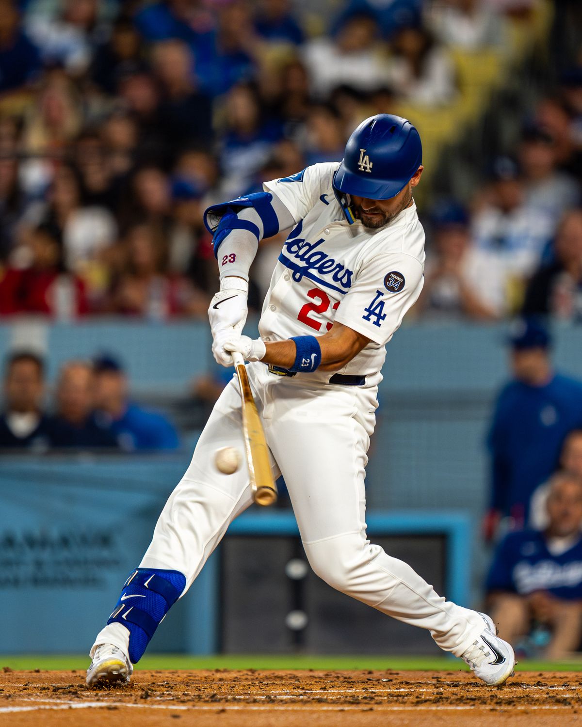 Los Angeles Dodgers outfielder, Michael Conforto 23, hits a double during an MLB baseball game against the Cincinnati Reds on August 26, 2025 in Los Angeles, CA.