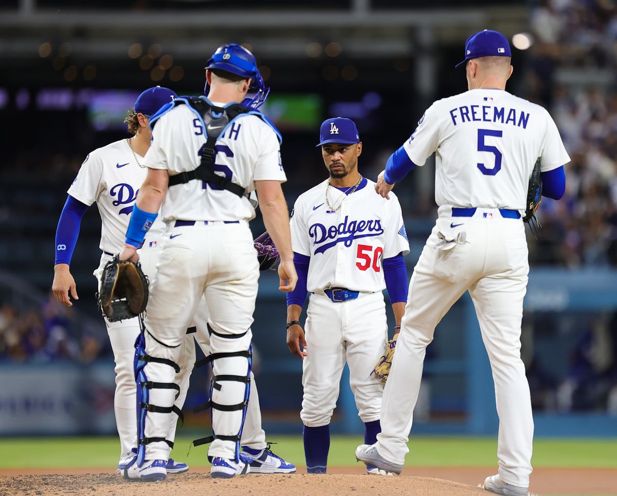 Multiple Los Angeles Dodgers players meet at the mound during a pitching change at an MLB baseball game against the Arizona Diamondbacks on August 29, 2025 in Los Angeles, CA. Multiple Los Angeles Dodgers players meet at the mound during a pitching change at an MLB baseball game against the Arizona Diamondbacks on August 29, 2025 in Los Angeles, CA.