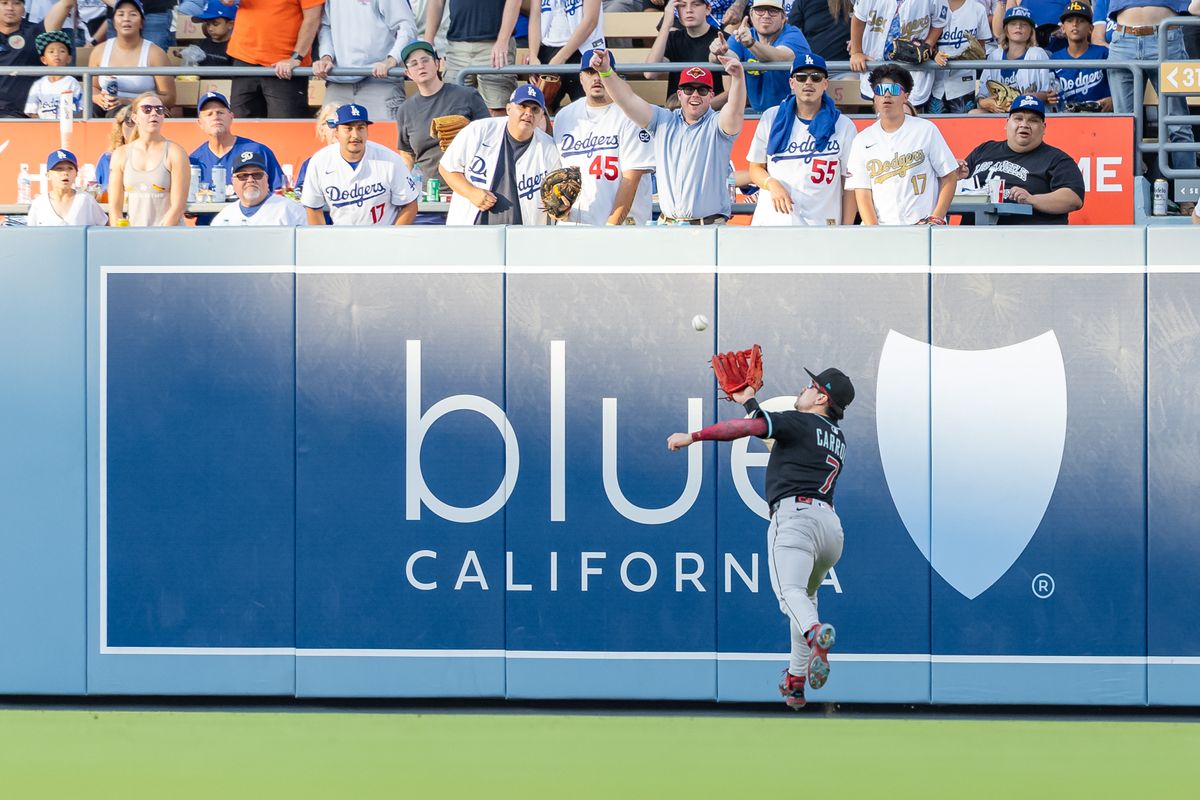 Corbin Carroll #7 of the Arizona Diamondbacks makes a play in the outfield during an MLB game against the Los Angeles Dodgers at Dodger Stadium on August 30, 2025 in Los Angeles, California.