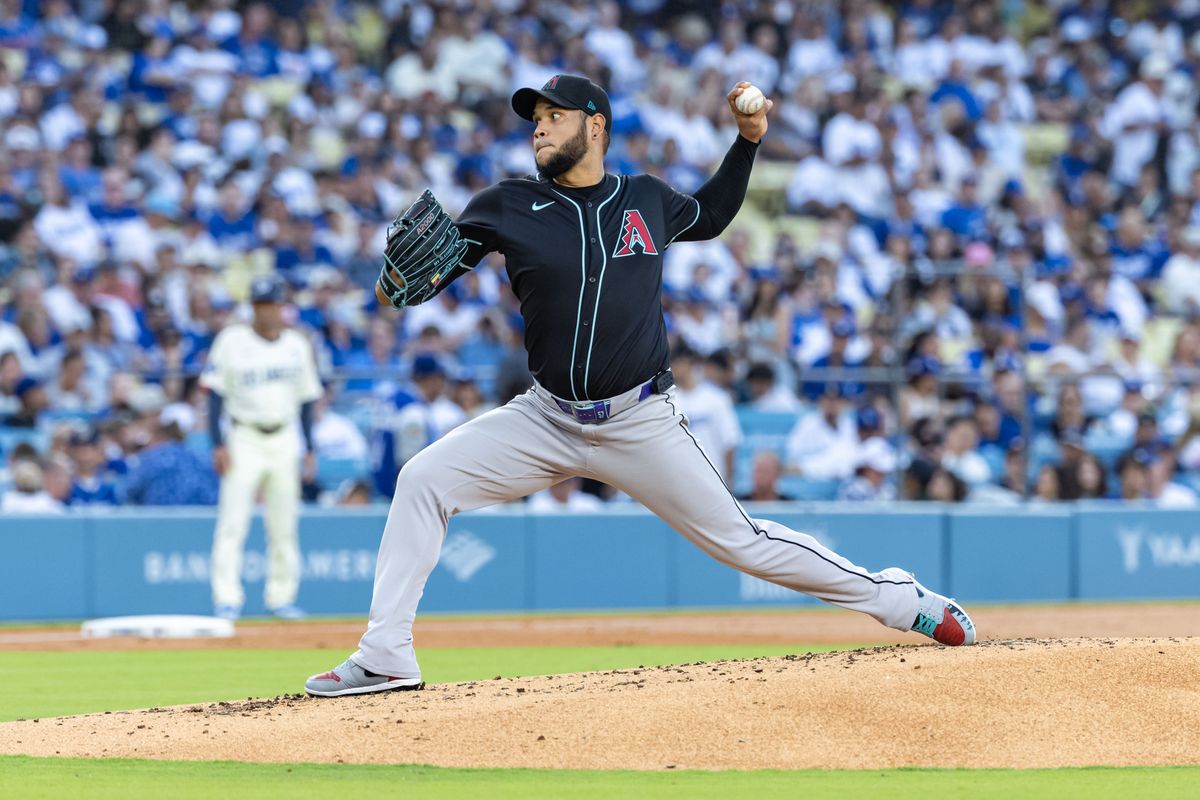 Eduardo Rodriguez #57 of the Arizona Diamondbacks throws a pitch during an MLB game against the Los Angeles Dodgers at Dodger Stadium on August 30, 2025 in Los Angeles, California.