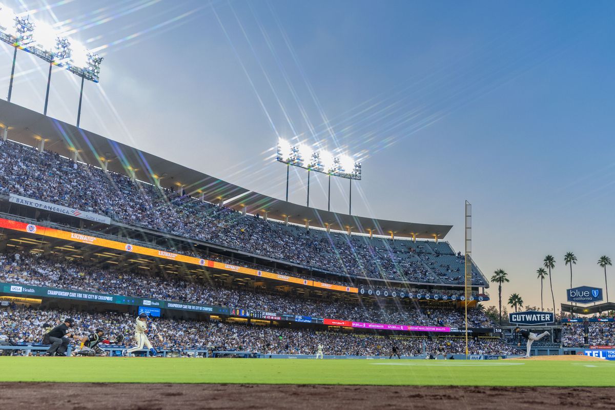 Alex Call #12 of the Los Angeles Dodgers squares up a pitch from Eduardo Rodriguez #57 of the Arizona Diamondbacks during an MLB game at Dodger Stadium on August 30, 2025 in Los Angeles, California.
