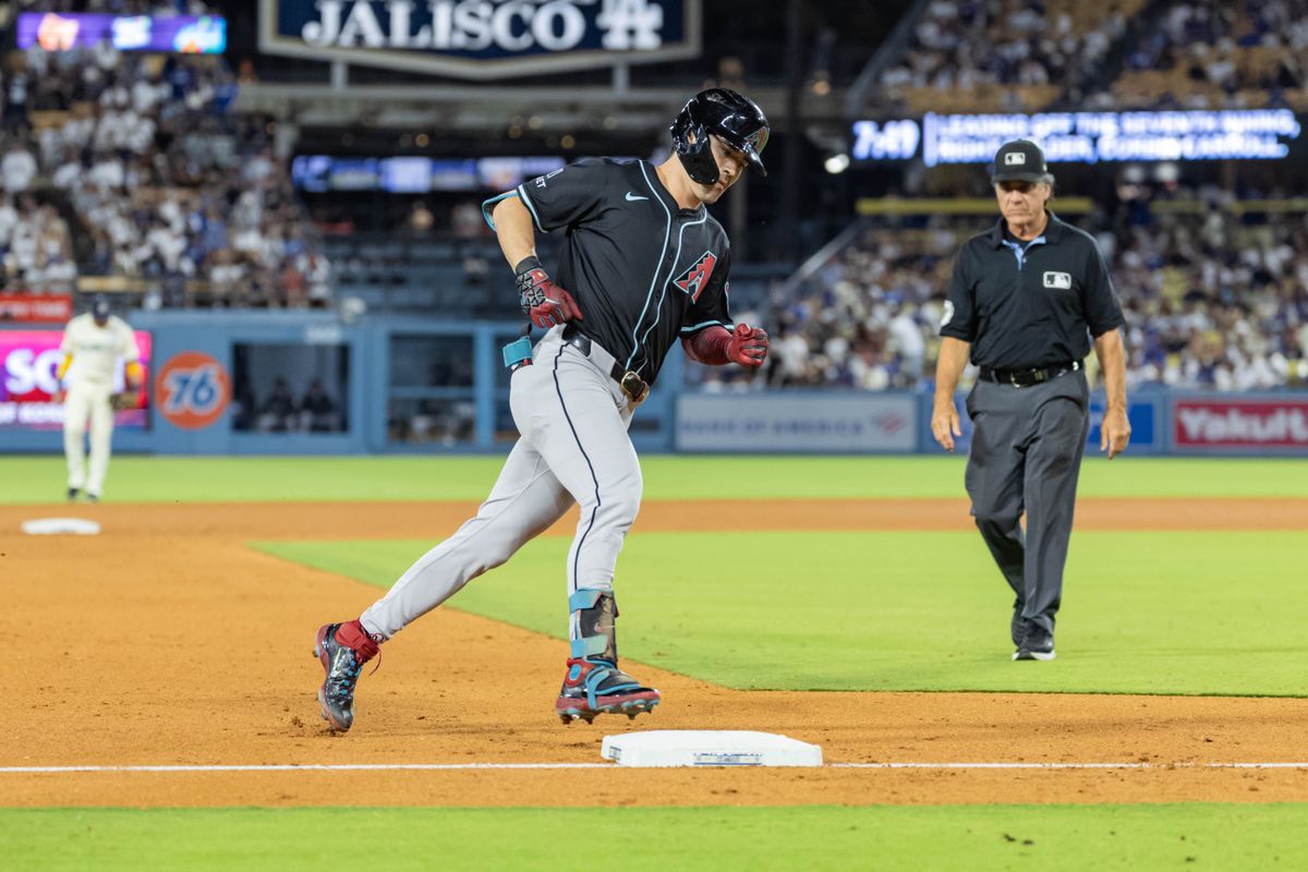 Corbin Carroll #7 of the Arizona Diamondbacks rounds third base after hitting a home run during an MLB game against the Los Angeles Dodgers at Dodger Stadium on August 30, 2025 in Los Angeles, California.