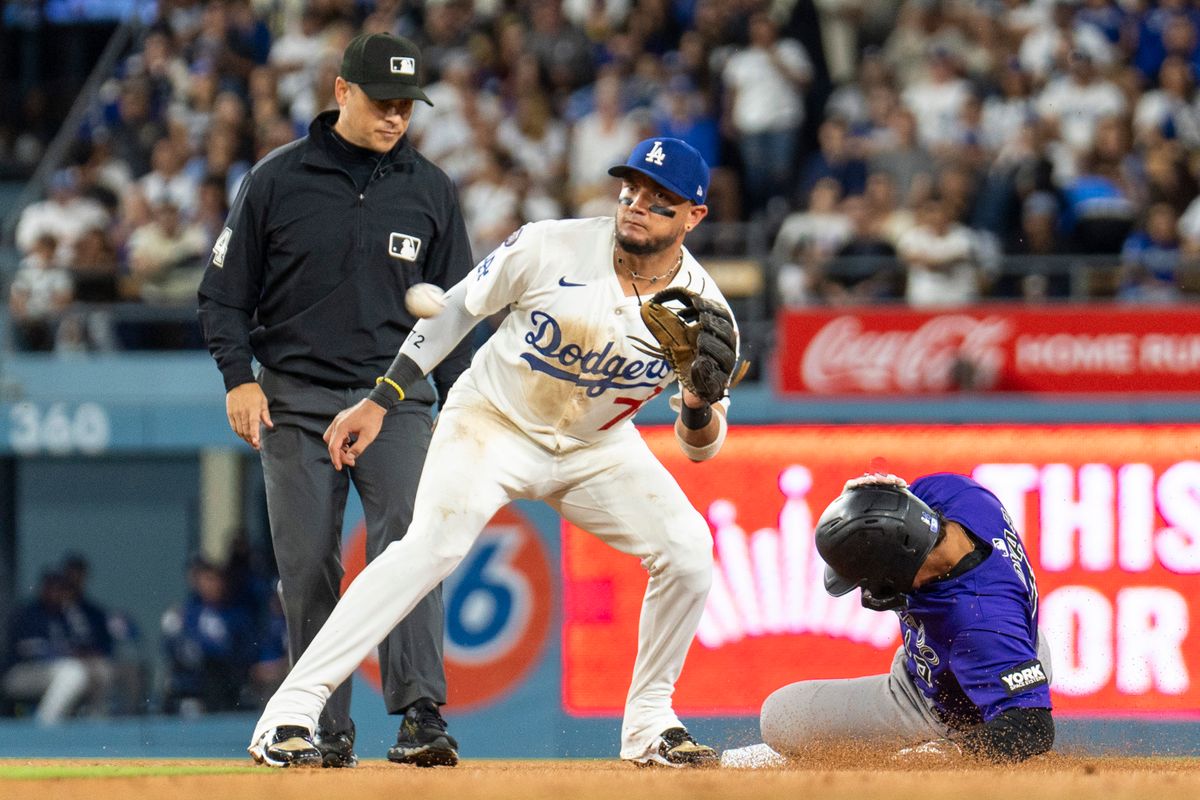 Los Angeles Dodgers infielder Miguel Rojas (72) almost gets the out at second base during an MLB baseball game against the Colorado Rockies, Wednesday September 10th, 2025 in Los Angeles, California. Los Angeles Dodgers infielder Miguel Rojas (72) almost gets the out at second base during an MLB baseball game against the Colorado Rockies, Wednesday September 10th, 2025 in Los Angeles, California.