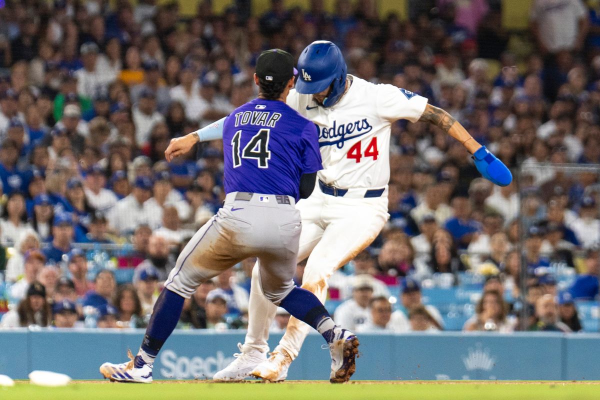Los Angeles Dodgers outfielder Andy Pages (44) tries to avoid the tag during an MLB baseball game against the Colorado Rockies, Wednesday September 10th, 2025 in Los Angeles, California. Los Angeles Dodgers outfielder Andy Pages (44) tries to avoid the tag during an MLB baseball game against the Colorado Rockies, Wednesday September 10th, 2025 in Los Angeles, California.