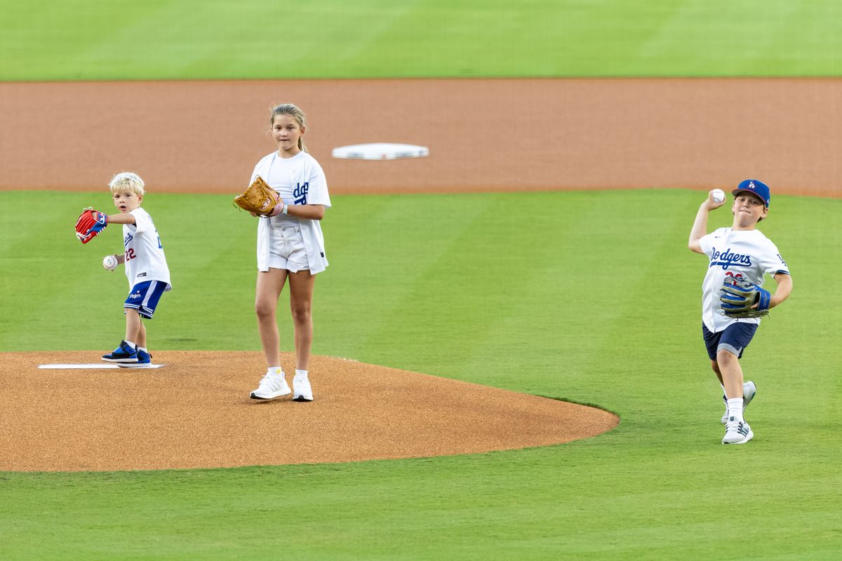 Cali, Charley, and Chance Kershaw throw out the first pitch before an MLB game between the Los Angele Dodgers and San Francisco Giants at Dodger Stadium on September 20, 2025 in Los Angeles, California. Cali, Charley, and Chance Kershaw throw out the first pitch before an MLB game between the Los Angele Dodgers and San Francisco Giants at Dodger Stadium on September 20, 2025 in Los Angeles, California.