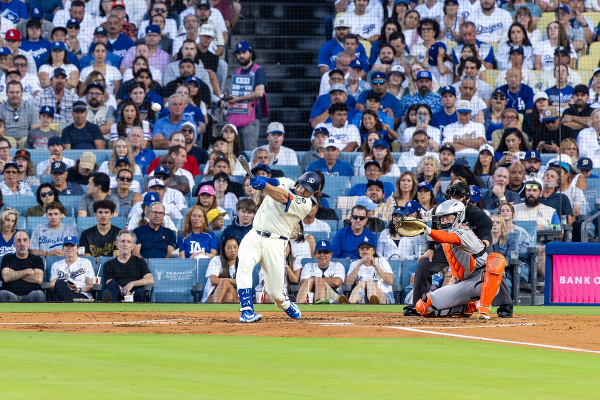 Max Muncy #13 of the Los Angeles Dodgers hits a home run during an MLB game against the San Francisco Giants at Dodger Stadium on September 20, 2025 in Los Angeles, California. Max Muncy #13 of the Los Angeles Dodgers hits a home run during an MLB game against the San Francisco Giants at Dodger Stadium on September 20, 2025 in Los Angeles, California.
