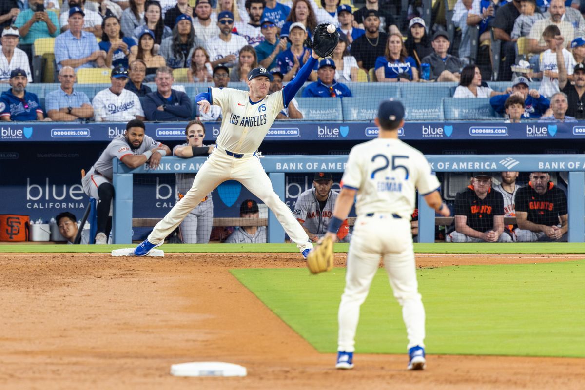 Freddie Freeman #5 of the Los Angeles Dodgers stretches to make a play at first base during an MLB game against the San Francisco Giants at Dodger Stadium on September 20, 2025 in Los Angeles, California. Freddie Freeman #5 of the Los Angeles Dodgers stretches to make a play at first base during an MLB game against the San Francisco Giants at Dodger Stadium on September 20, 2025 in Los Angeles, California.